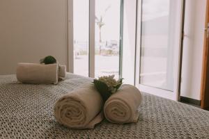 Ένα ή περισσότερα κρεβάτια σε δωμάτιο στο Casa Analino +51 φωτογραφίες