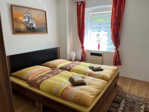 Postel nebo postele na pokoji v ubytování Apartmány Merkel
