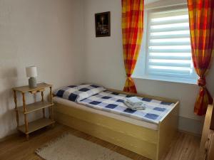Postel nebo postele na pokoji v ubytování Apartmány Merkel