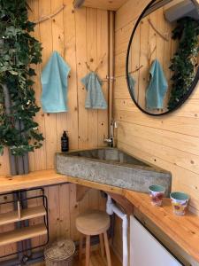 a bathroom with a sink and a mirror at Hus Siknäs in Mora +47 photos