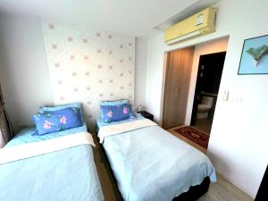 Postel nebo postele na pokoji v ubytování 中央公寓 1bedroom Centrio 804 Condominium 211