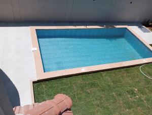 an overhead view of a swimming pool in a house at New furnitured villa with swimming pool and garden at King Mariot in Alexandria +15 photos