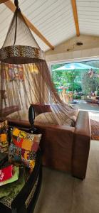 a hammock in a room with a patio at Domaine du lagon bleu in Comps