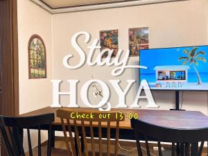 a sign that says stay hollywood on a wall at Daegu Stay Hoya in Daegu