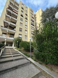 a building with stairs in front of a building at RAHIMA GUEST HOUSe 2 in Rome