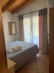 A bed or beds in a room at Villa Veronica