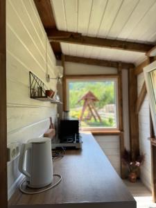 a view of a kitchen in a tiny house at Гражда Лофт для двох в Карпатах in Krivorovnya