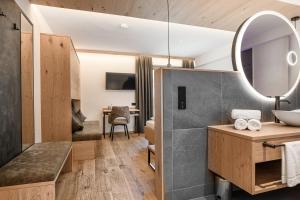 TV a/nebo společenská místnost v ubytování Hotel Hubertushof