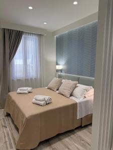Ένα ή περισσότερα κρεβάτια σε δωμάτιο στο Ines Apartments