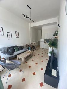 a living room with a couch and a table at Apartament Hana in Golem