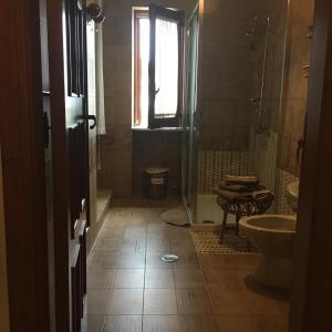 a bathroom with a sink and a toilet and a window at Villa Stefania in Stazione di Paestum +29 photos