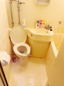 a bathroom with a toilet and a sink at Tokyo 2beds room in Shinjuku Sanchome in Tokyo