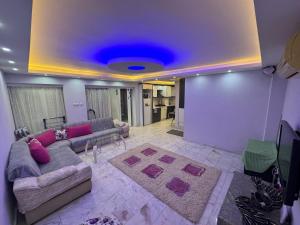 a living room with a couch and a rug at Can’s Homes in Kuşadası