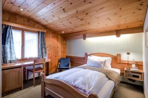 Postel nebo postele na pokoji v ubytování Hotel Alpfrieden