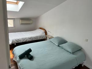 Rúm í herbergi á Maison avec vue sur le Viscos