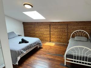 Postel nebo postele na pokoji v ubytování Maison avec vue sur le Viscos