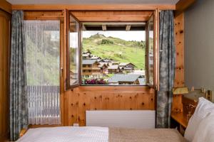 Postel nebo postele na pokoji v ubytování Hotel Alpfrieden