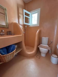 a bathroom with a toilet and a sink at Simos suites in Elafonisos