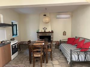 a living room with a couch and a table at Sunshine 1 in Leonidio