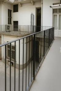 a balcony with black railing in a building at Casa vivace in centro Torino by Turin House Collection in Turin