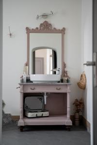 a bathroom vanity with a sink and a mirror at Casa Viola Bed and Breakfast Dimora di campagna in Calice Ligure