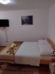 Ένα ή περισσότερα κρεβάτια σε δωμάτιο στο Studio Apartman *** Mara