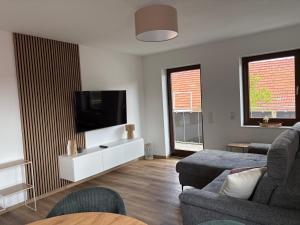 TV a/nebo společenská místnost v ubytování Kegelspiel Apartments
