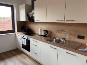 Kuchyň nebo kuchyňský kout v ubytování Kegelspiel Apartments
