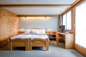 Postel nebo postele na pokoji v ubytování Hotel Alpfrieden