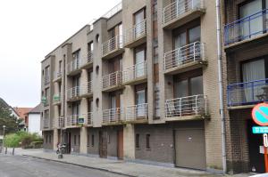 an apartment building with balconies on the side of it at Apartment Franky in Ostend