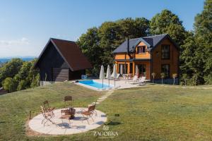 a house on top of a hill with a pool at Boutique Villa Zagorka in Stubicke Toplice