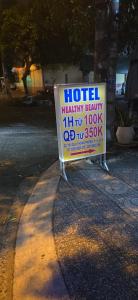 a sign sitting on the side of a street at Hotel kỳ hòa in Ho Chi Minh City