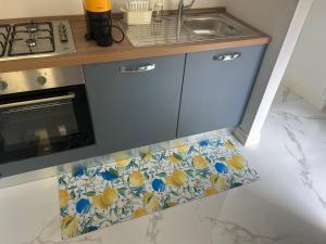 a kitchen with a sink and a counter top at suite pure air in Omegna