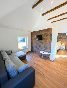 Posezení v ubytování Lake & Bike Holidays Wüstenhain, Ferienhaus am Gräbendorfer See + 31 fotografií