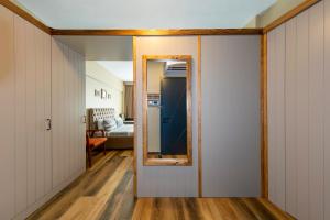 a hallway with a door leading to a living room at Kadıköy Modern Loft & Equipped Stay in Istanbul +14 photos
