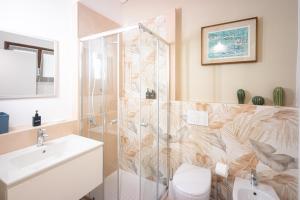 a bathroom with a shower and a toilet and a sink at Atelier Salvetti in Colle di Val d'Elsa +23 photos