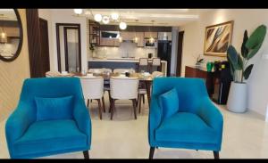 a kitchen and dining room with a table and chairs at Maple vista in Dargai