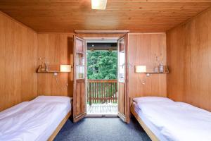 Postel nebo postele na pokoji v ubytování Hotel Alpfrieden