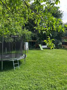 a trampoline in the grass in a park at RanczoLatyczyn in Latyczyn