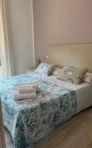 a bed with two pillows on top of it at Venice Queen Apartments in Cavallino-Treporti