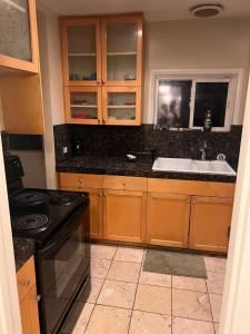 a kitchen with a sink and a stove at Downtown Neighborhood Room 3 in Phoenix