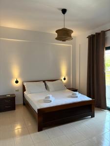 Ένα ή περισσότερα κρεβάτια σε δωμάτιο στο Elià Apartments +29 φωτογραφίες