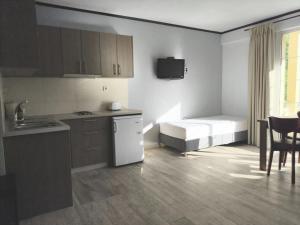Кухня или мини-кухня в Amimaya Apartments
