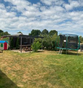 a park with a playground and a swing at Apartamenty Cztery Siostry in Zastań