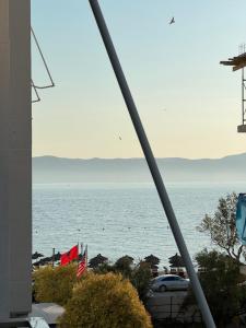a view of the ocean from a building at Stylish Apartment 50m from Radhimë Beach in Vlorë