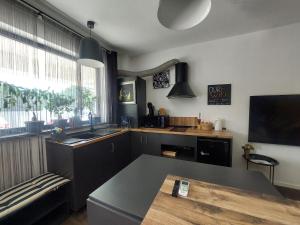 a kitchen with a sink and a counter top at Best City Green in Craiova