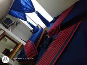a close up of a bed in a room at Hotel Diamantes Orizaba Boutique in Orizaba