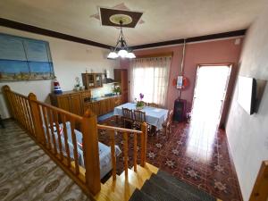 a kitchen and dining room with a table in a room at Villa Sette Nani in Torre Lapillo