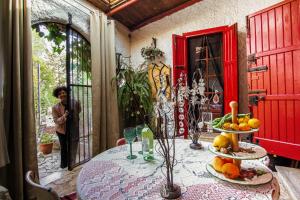 a table with plates of fruit on top of it at Villa Parco Alta Murgia in Cassano delle Murge
