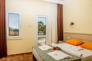 Postel nebo postele na pokoji v ubytování Magic Tulip Hotel